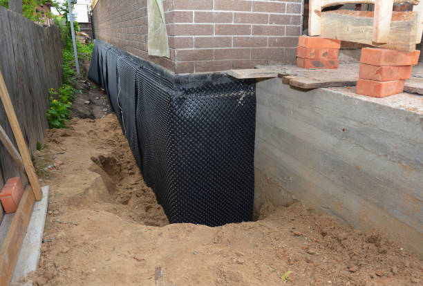 SJ Waterproofing Pros technician performing targeted Waterproofing assessment in Etna, PA
